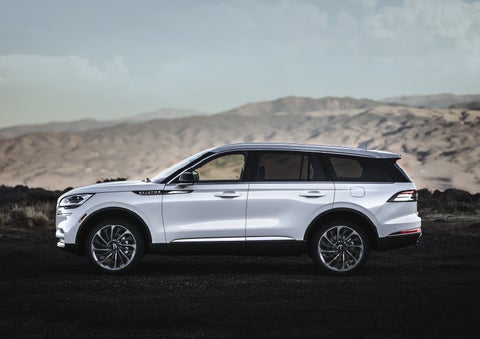A Lincoln Aviator® SUV is parked on a scenic mountain overlook | Libertyville Lincoln Sales, Inc. in Libertyville IL