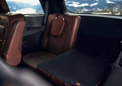 The left rear seat of a 2024 Lincoln Aviator® SUV is shown folded flat for additional cargo space | Libertyville Lincoln Sales, Inc. in Libertyville IL
