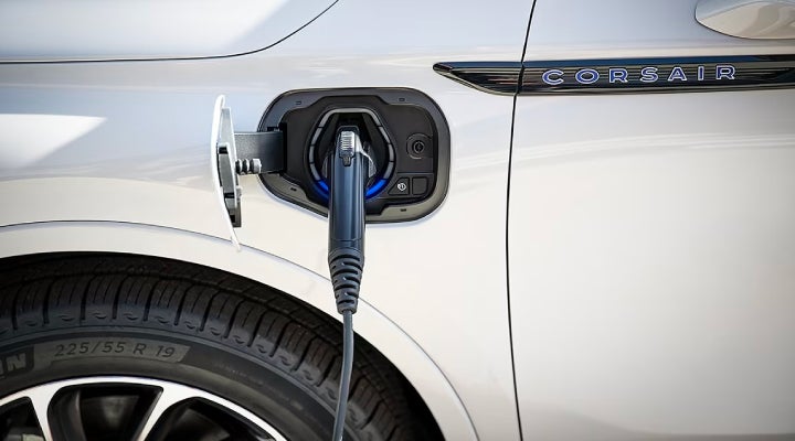 An electric charger is shown plugged into the charging port of a Lincoln Corsair® Grand Touring
model. | Libertyville Lincoln Sales, Inc. in Libertyville IL